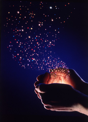 1993 --- Hands Releasing Stars --- Image by © Clayton J. Price/CORBIS